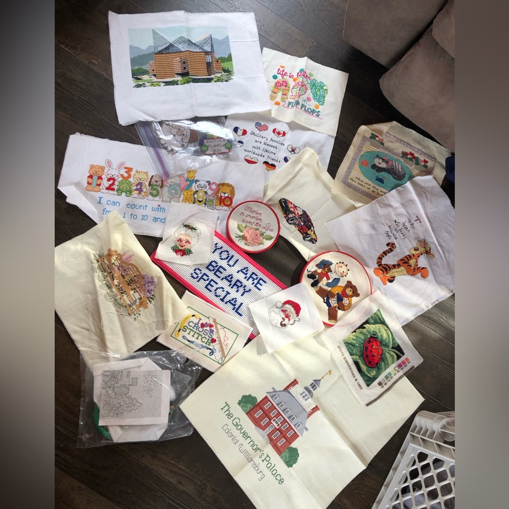Lot of 18 finished cross stitch pieces.